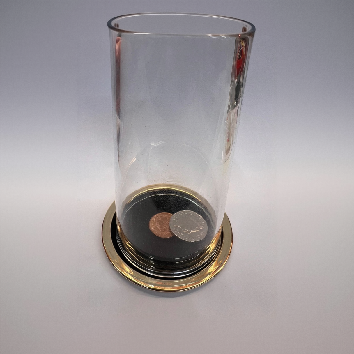 Coin Thru Glass (gold) - The Scarborough Joke Shop