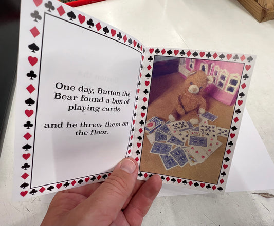 Botón El truco de cartas del oso