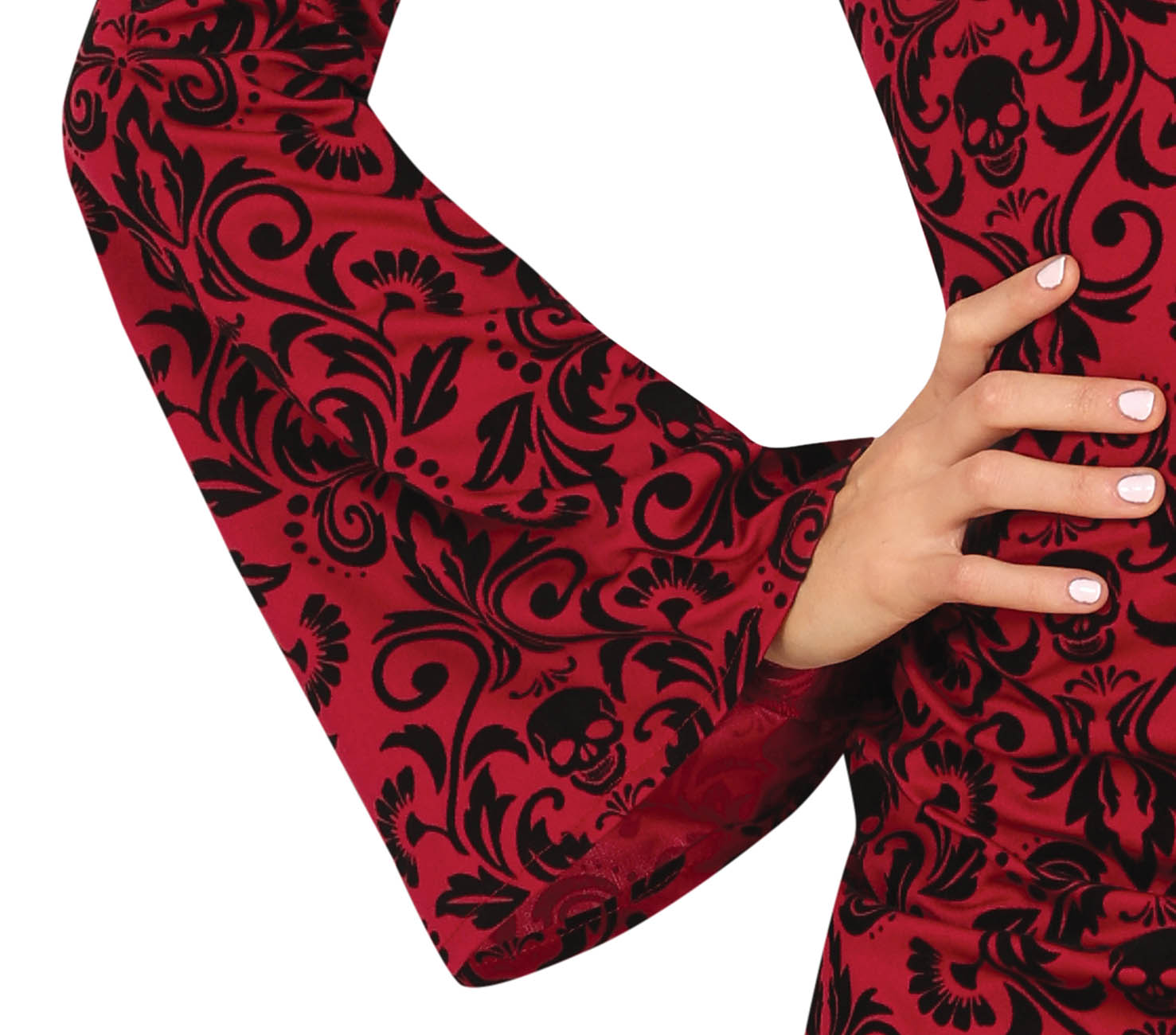 Red fabric with black floral and skull pattern held by a hand on a white background