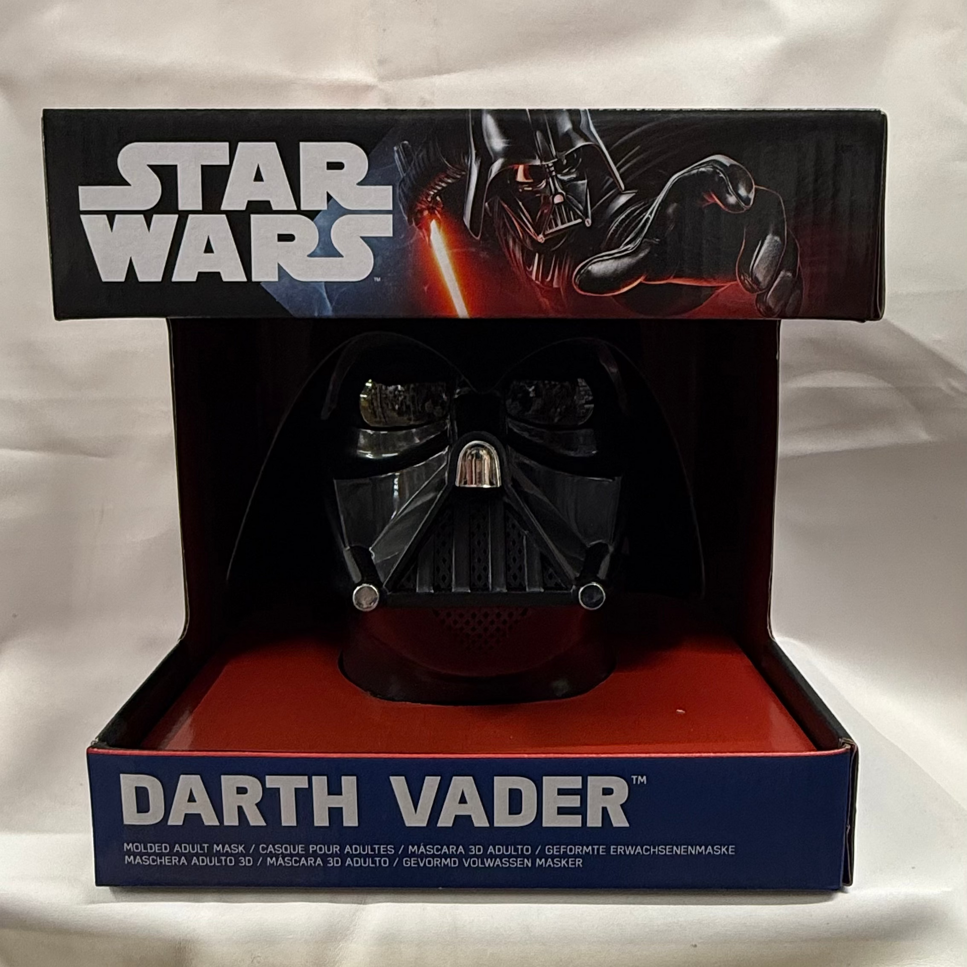 Darth Vader mask in packaging with 'Star Wars' branding on a white background
