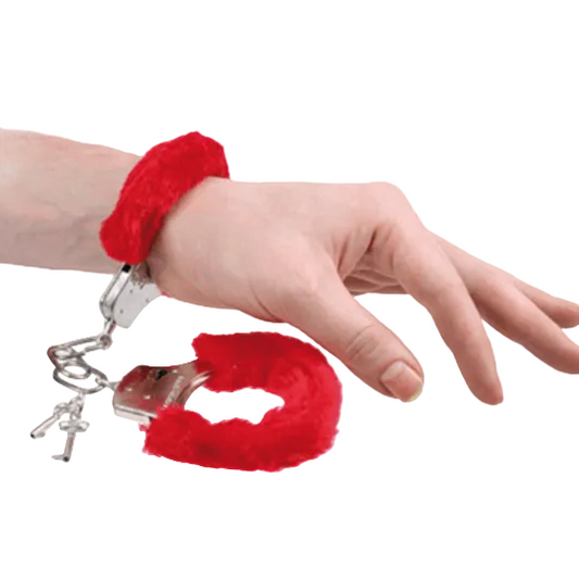 The image shows a set of furry handcuffs in black and pink, along with their packaging. The handcuffs are covered with plush material, and the packaging includes a 'Scarborough' branded box.
